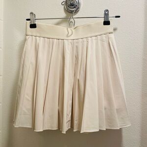 Aritzia TNA Cream Tennis Skirt w shorts inside